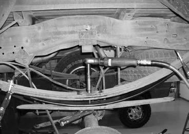 51. Working on the driver side and using a die grinder, carefully cut off the excess thread from the new centering bolt. Repeat procedure on the passenger side. 52. Locate the stock blocks.