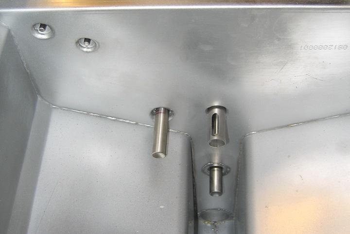 The actuators are held in place by two Allen screws. Loosen the Allen screws. It may be necessary to remove a gas line to the burner when removing a drain actuator.