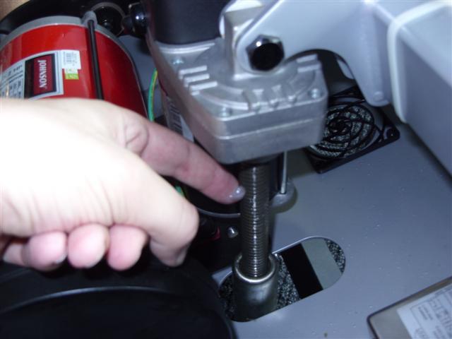 Loosen the rear roller screws (turn counter-clockwise) by ½ turn or less on ea