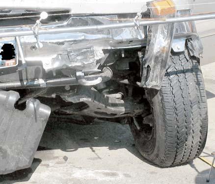 VEHICLE DAMAGE Exterior Damage The 2006 Chevrolet Silverado sustained moderate undercarriage damage as a result of the impact with the ground and curb.