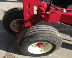 ADJUSTABLE BRAKE BANDS on the front gauge wheels can be easily adjusted to field conditions or transport.
