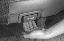 To fold the seat, pull on the release handle at the bottom of the seat cushion marked RELEASE.