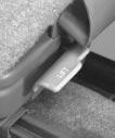 There is a foot-operated release lever for rear seat passengers to use when getting out of the third seat.