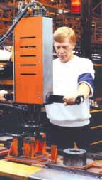 Easy spindle removal for maintenance or calibration Remote spindle indicator lights Repair bay operator is using a two spindle fixtured tool to fasten components of a wheel hub assembly.