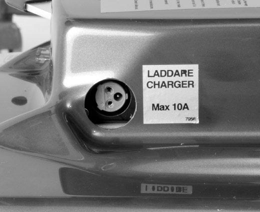 an outlet in the front of the rear chassis cover.