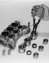 Insert smaller diameter end of V-Packing Spacer into V-Packing Cylinder. 8. Invert the Inlet Manifold with crankcase side down.