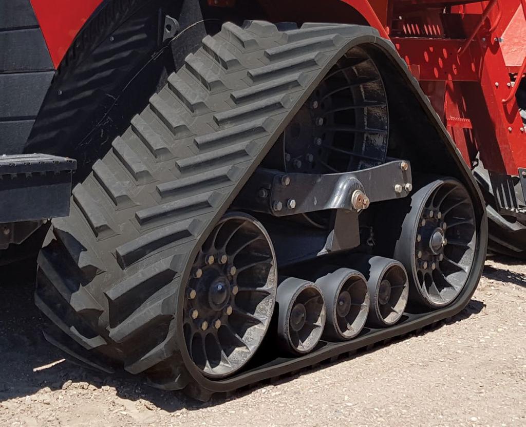 TRACK FOR QUADTRAC Exclusive 32'' wide track The additional 2" width of Camso track vs. the 30" keeps the idler wheels centered on the main cables.