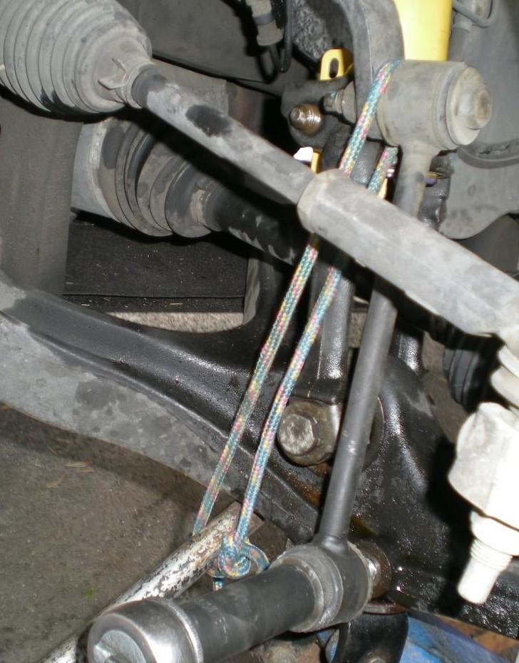 Last Trick. You now have to reconnect the sway bar. Unfortunately, the bar end does not line up with the hole.