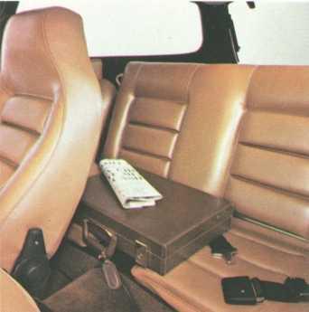 We've improved the rear seat to a point where we can tell you it's upholstered in leather, comes equipped with two lap belts.