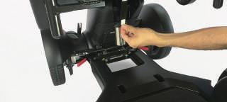 Pull down on the seat release lever and attach the
