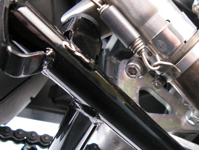 For stainless steel muffler only: align the muffler in respect to the motorcycle and