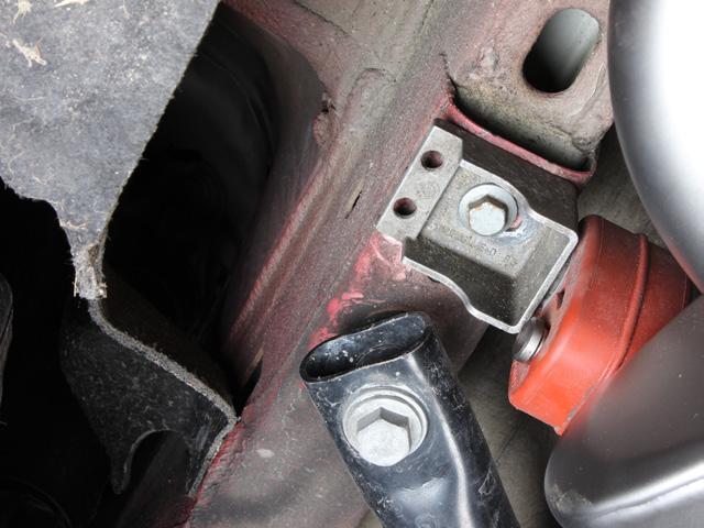 rubber brackets onto the vehicle chassis (Figure 7).