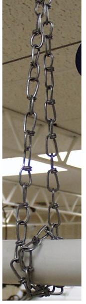 The feed system should be restrained from swinging by wrapping chain completely around tubing and securing the chain with S hooks.