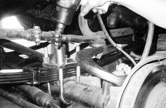 FIG. 5 13. Re-secure drag link to new steering arm and lock with cotter pins. 14. Install recommended replacement BDS shocks and reinstall front wheels and tires.