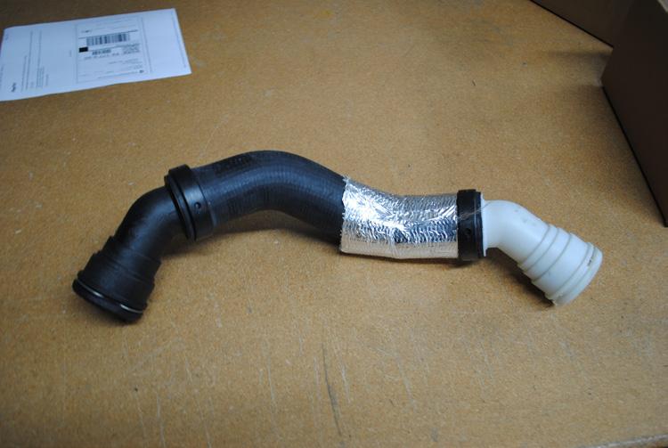(Image 9) Step 14: Remove the upper radiator hose from the thermostat housing.