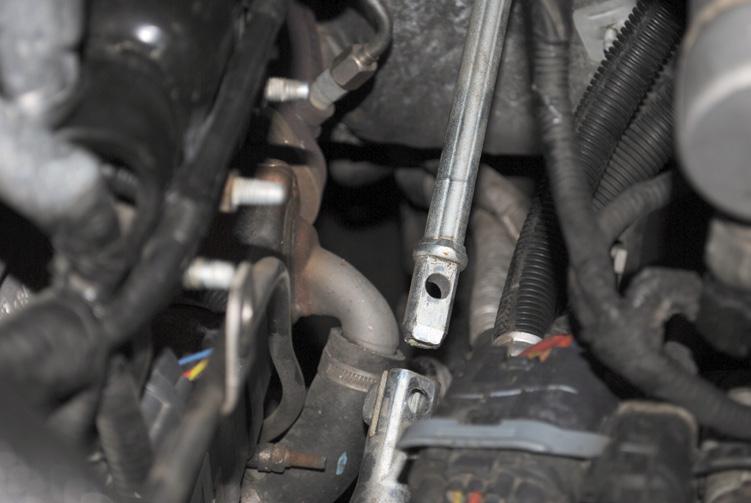Step 16: Remove the steering shaft bolt and slide the stem up and out of the steering box shaft.