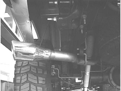 DO NOT tighten the clamps. For system part number, place a clamp over the expanded end of each tailpipe assembly and place them into position installing the hangers into the rubber brackets.