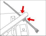 2. Feed wire ties into the plastic mounts from the rear to front, orienting the