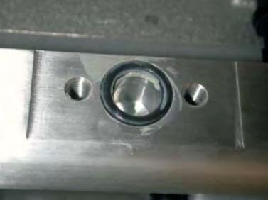 Apply a small amount of grease to the new supplied fuel manifold O-ring and set in the machined
