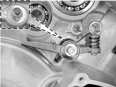 lever, squeeze the spring in to the groove of the left crankcase.