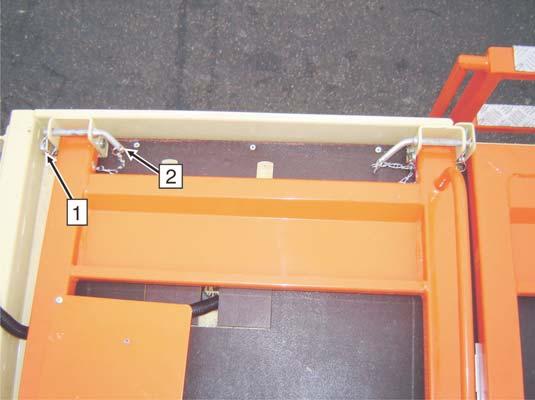 SECTION 4 - MACHINE OPERATION 2. Carefully lower rails inward to the platform deck. 3. Secure rails by inserting Main Pins back into brackets and securing pin with Safety Pins.