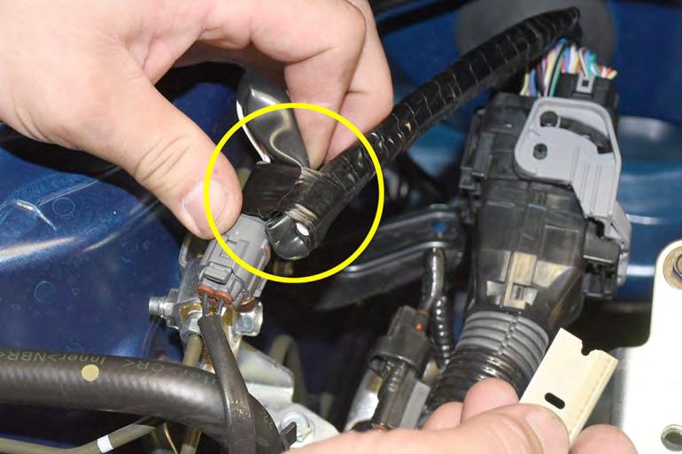 31. Locate the primary O2 sensor connection on the passenger side strut