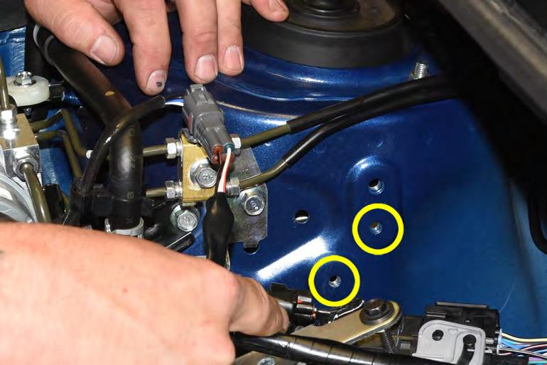 Guide the lower coolant hose underneath the main wire harness while installing the AOS.