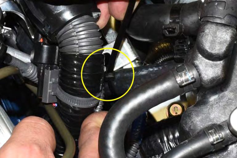 The line will route over the transmission, thru the turbo support bracket and finally lead to the ½ port on the plastic
