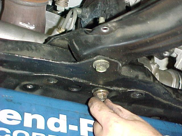 nuts and three bolts holding the lower engine