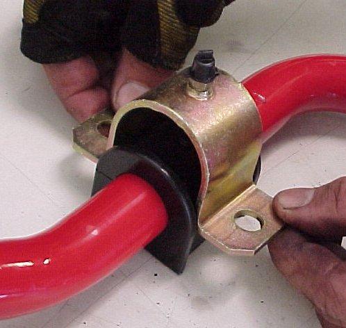 Place the greased bushing over the sway bar with the split in the bushing towards the