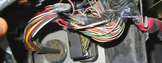 26 At the PCM connector, locate pin #54. It should be a violet wire with yellow tracer. Cut this wire in a convenient location, leaving enough wire to butt connect to each wire end.