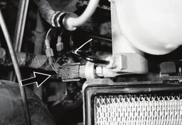 FOR VEHICLES WITH CRUISE CONTROL ONLY 32 Ford installs a brake pressure applied switch on the front lower side of the master cylinder. Locate the black wire with a yellow stripe in the FORD harness.