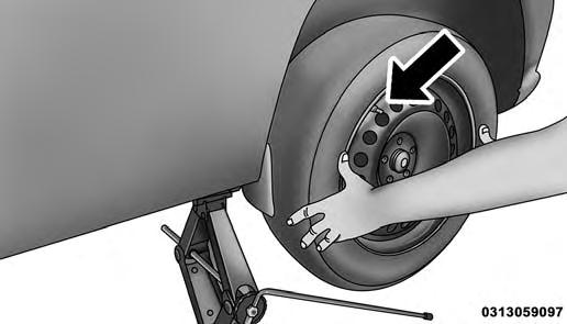 268 WHAT TO DO IN EMERGENCIES 5. Remove the wheel lug bolts. For vehicles with wheel covers, remove the cover from the wheel by hand. Do not pry the wheel cover off. Then pull the wheel off the hub.
