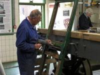 Tony Woodfield working on the mouldings on the London end of the coach Tony Woodfield