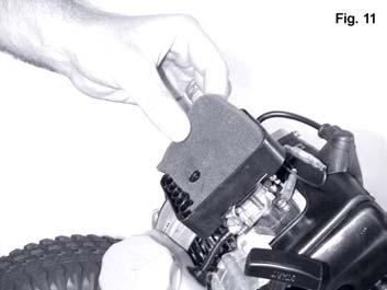Using a Philips head screwdriver, remove the carburetor cover by turning the cover screw counter clockwise. (Fig. 10) 2.