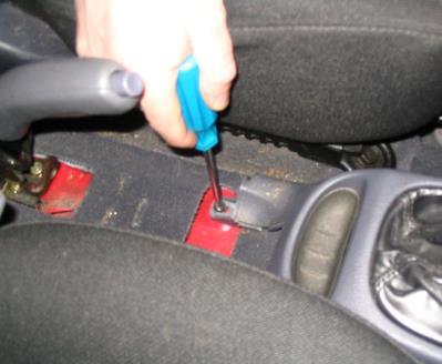 Remove the Philips head screws from the rear of the console on both the passenger and driver s