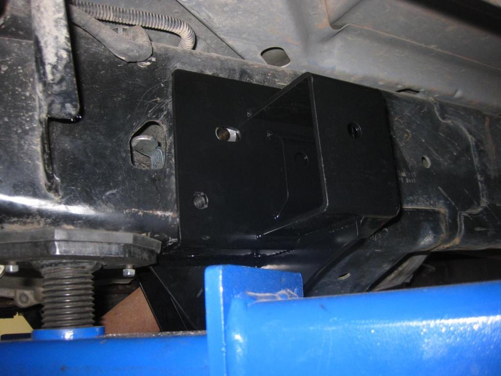 24) Once bracket in aligned with frame sleeves, install the