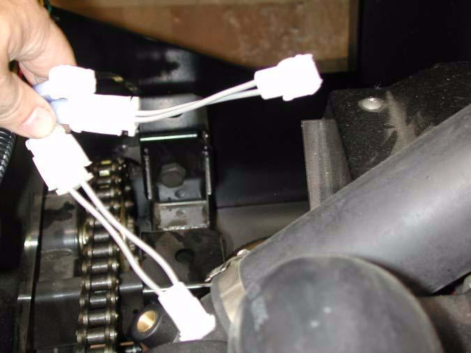 Raise the bed. The final two connectors are located among the bundle near the right rear corner of the engine compartment, at the top of the frame. See Figure 2.