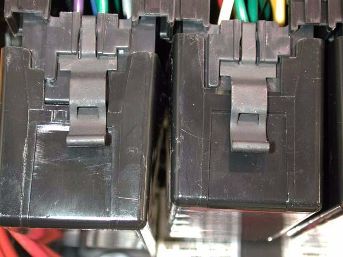 The one relay that is not in this group is the starter relay, which is located on the outside of the harness, just below
