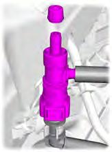 Attach suitable tool with a tube to the Schrader valve and place the end of the tube into a suitable container. 3. Open the Schrader valve. 4.