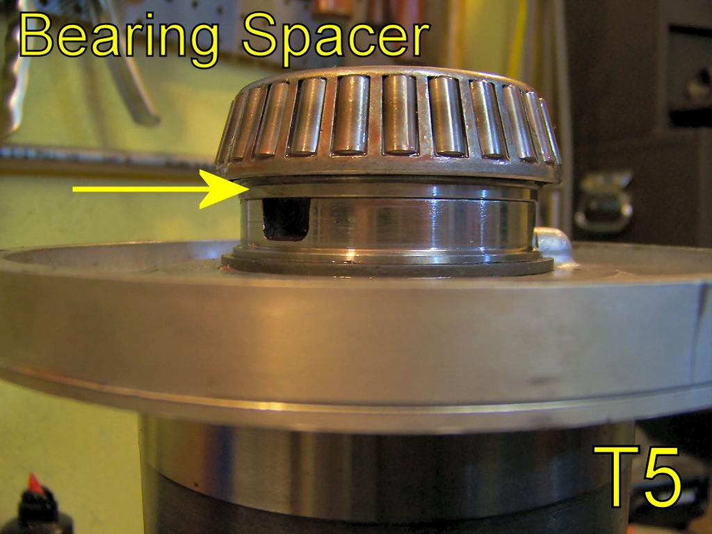 From your 928MS kit, slide the bearing spacer onto the LSD shaft and reinstall the bearing onto the shaft over it.