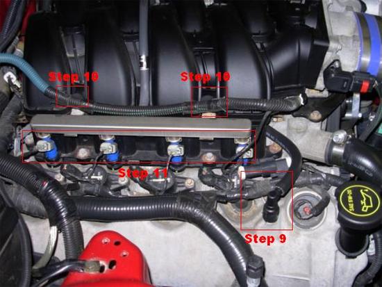 Remove the passenger side Breather Tube that connects into the valve cover by moving the green piece clockwise and pulling straight up on the tube. 10.