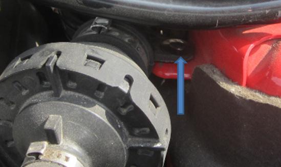 Use a trim panel removal tool or similar to release symposer tube from