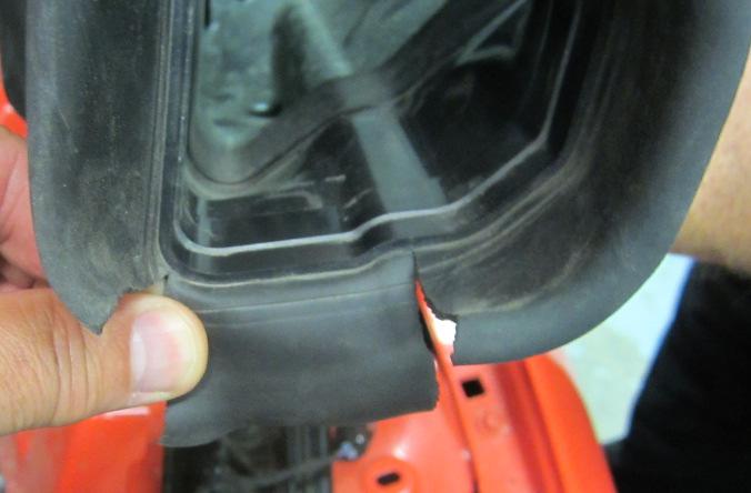 Modify air inlet rubber seal by making two cuts. Install air inlet on air cleaner assembly. Install air cleaner assembly into vehicle. Angle air cleaner assembly with air inlet down.