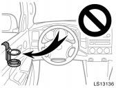 Do not attach a cup holder or any other device or object on or around the door.