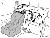 Pull the seatback release strap and swing the seatback forward slightly, then