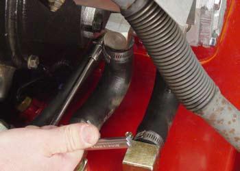 5. Install nuts on the two bolts from the rubber coupling to the pump hub and tighten (Fig.