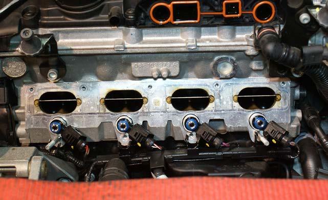 16) Remove nuts/bolts holding intake manifold to cylinder head.