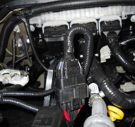 Note: Make sure to secure the ROUSH CleanTech underhood harness to keep it away from the steering column and other heated or moving components. Figure 15.4. 12.