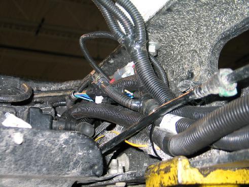 Route the bundling as needed along the OEM vehicle harness to the rear and to itself as needed. Use zip ties to secure.